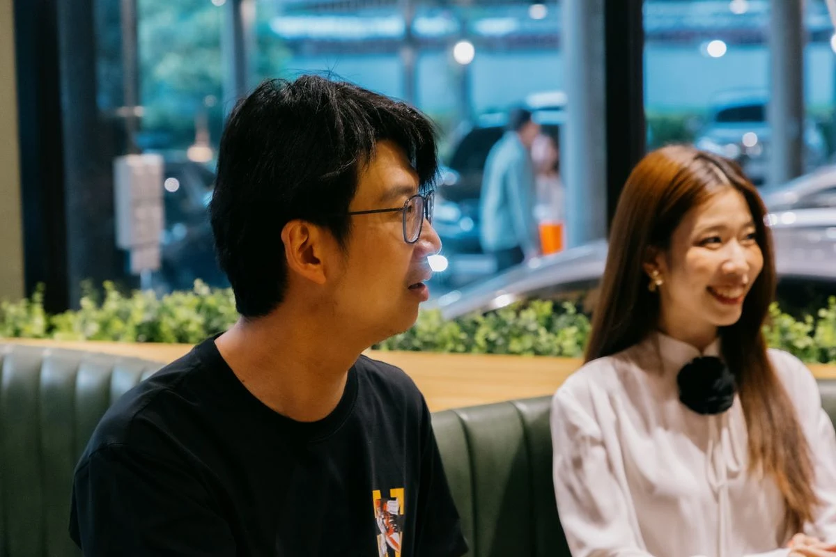 Members listening intently during a Flow's Table dinner conversation